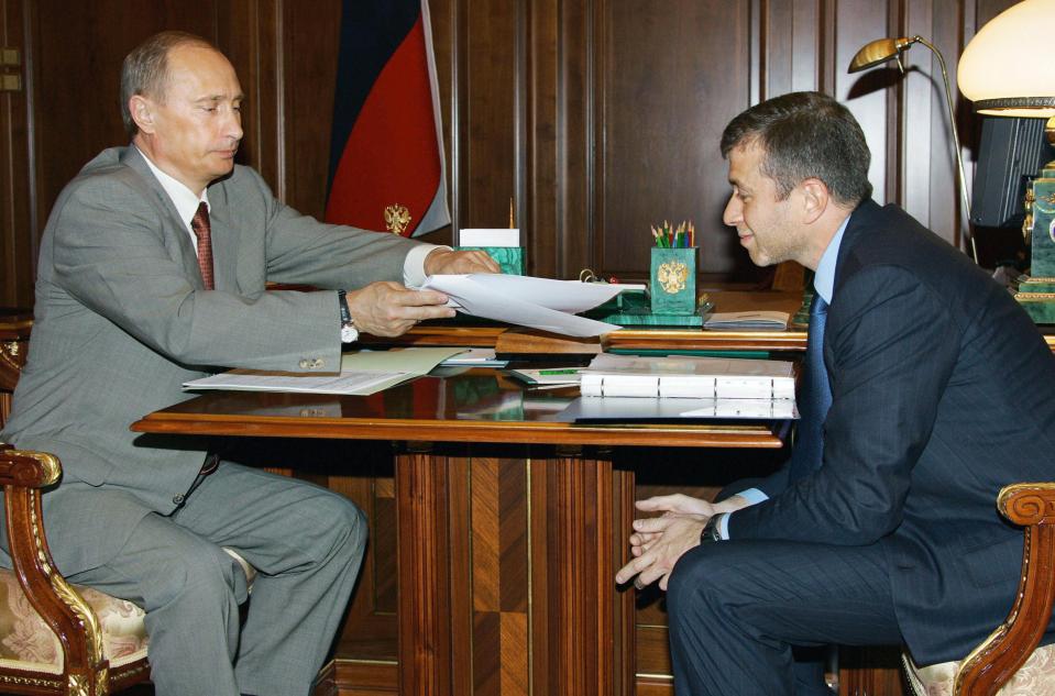  Roman Abramovich's close relations with Vladimir Putin has helped him become a billionaire. File picture showing the pair in 2005