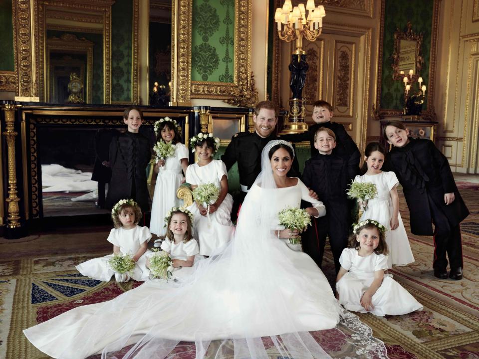  The appearance came as the first official photos from their spectacular Windsor nuptials were released