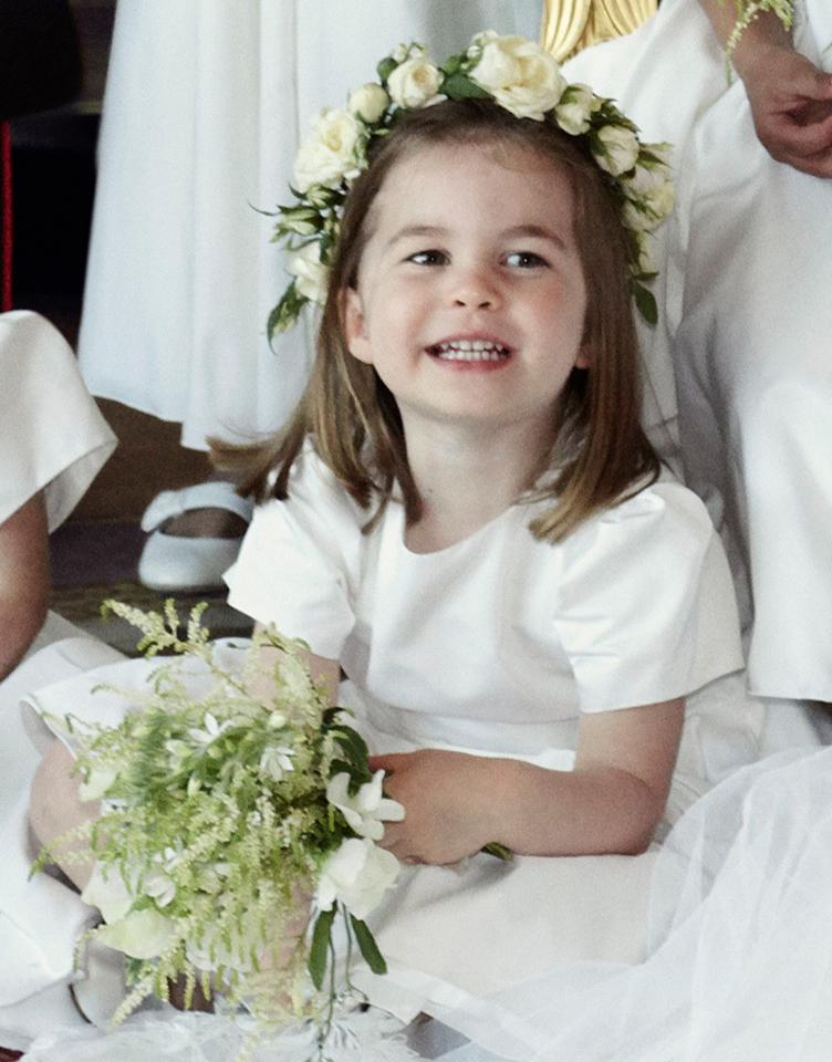  His little sister Princess Charlotte also put on a big smile as she sat beside her new auntie Meghan