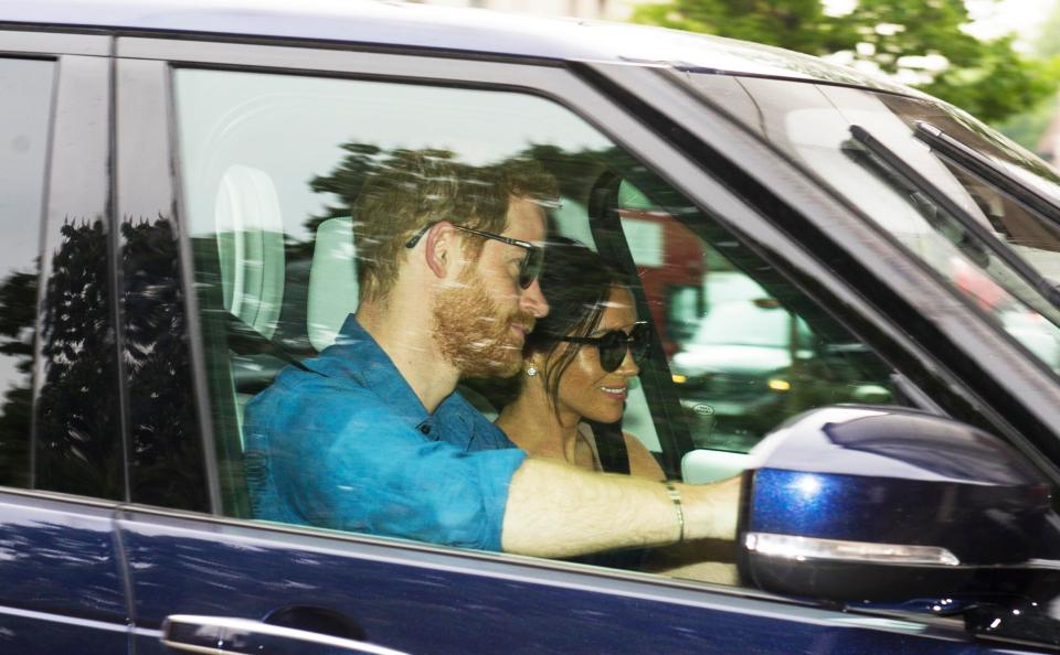  Harry was snapped driving his new bride into Kensington Palace in a Land Rover this afternoon