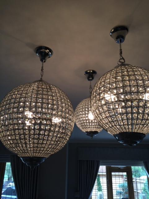 The couple have large glass light fittings