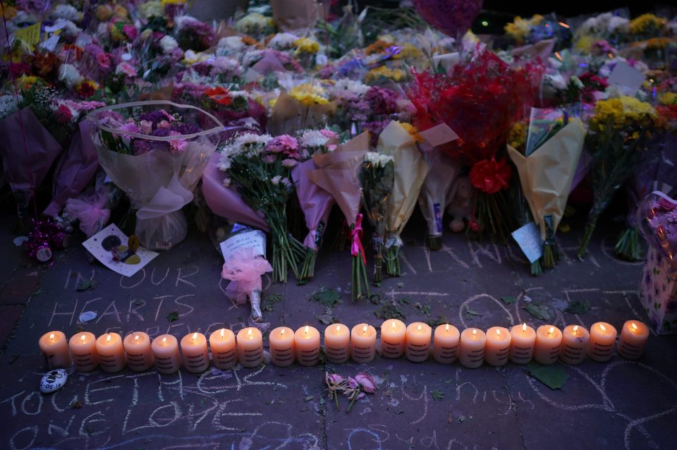  Candles and floral tributes floral adorn St Ann's Square