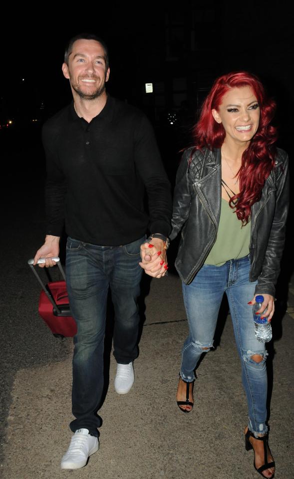  Anthony Quinlan acted the gent by carrying luggage as he supports girlfriend Dianne Buswell on tour