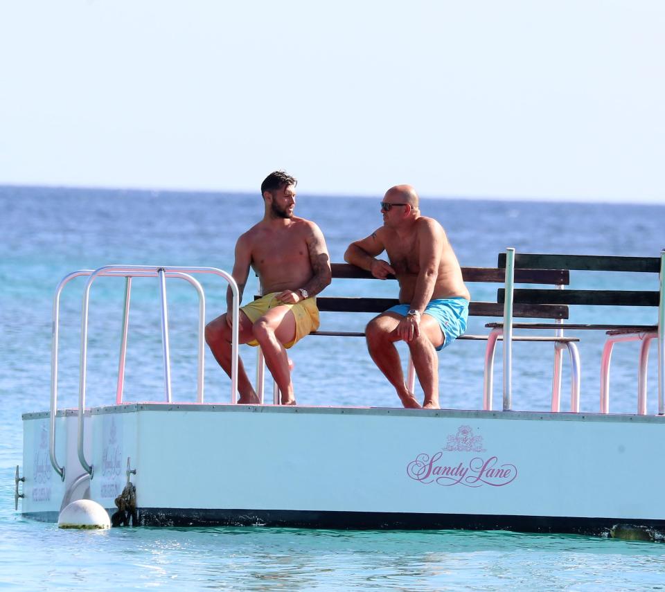  Charlie Austin relaxes on a pier as he enjoys summer holiday