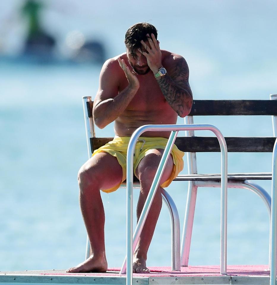  Charlie Austin dries himself off after taking dip in the ocean