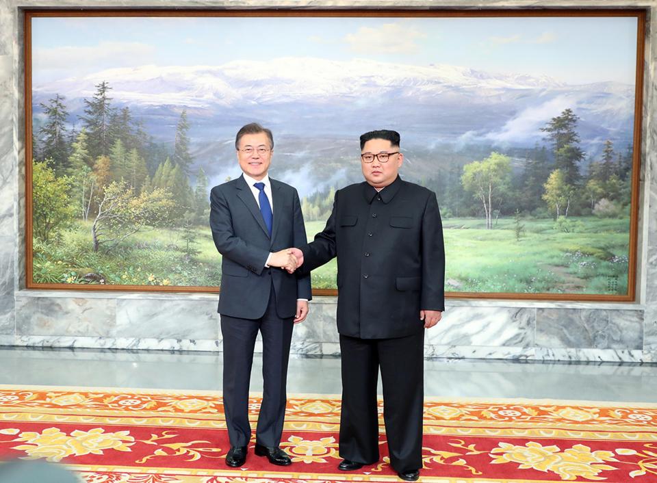  The leaders from either side of the Korea border shake hands at their peace talks