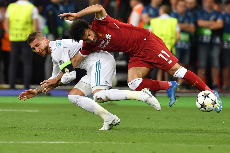 Sergio Ramos wrestles Mo Salah to the ground during the Champions League final