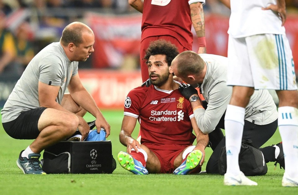 Salah receives treatment on the pitch during the Champions League final