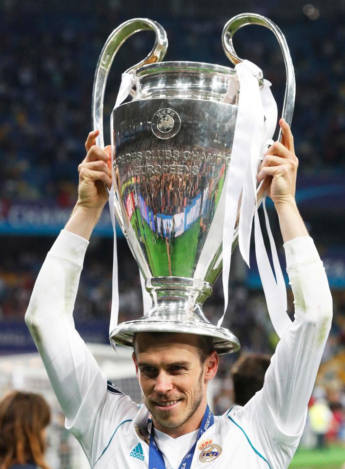  Gareth Bale with the Champions League trophy after his double helped beat Liverpool 3-1 in Kiev