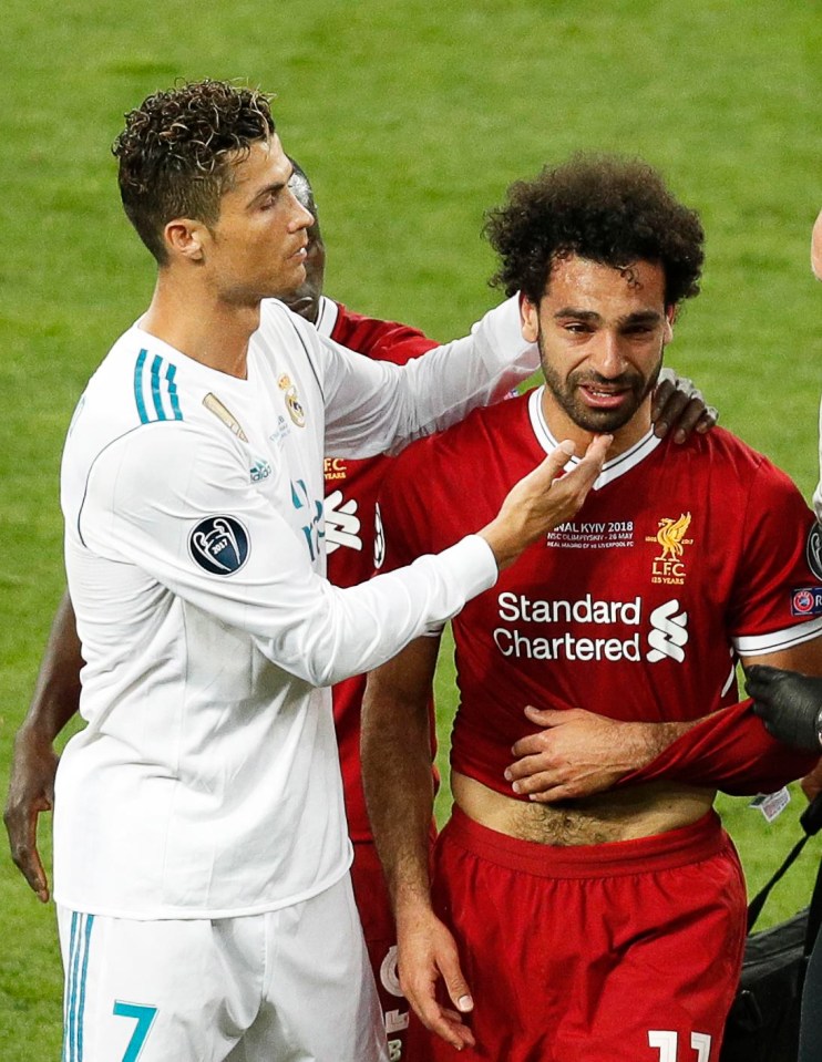 Cristiano Ronaldo consoles Mo Salah as he leaves the pitch in tears