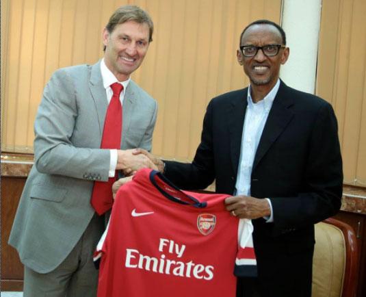  Gunners fan Paul Kagame, 60, seen here with former Arsenal captain Tony Adams, is paying £30million over three years for players to wear armbands urging tourists to visit impoverished Rwanda