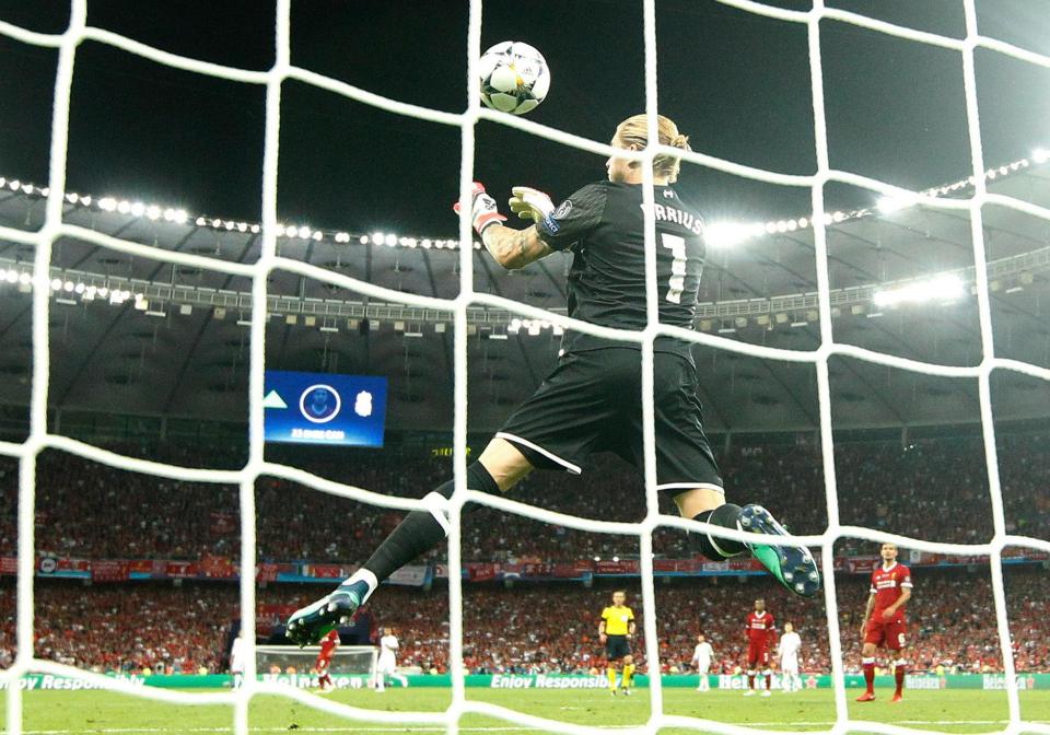  Loris Karius allows Gareth Bale's shot to squirm from his grasp into the net