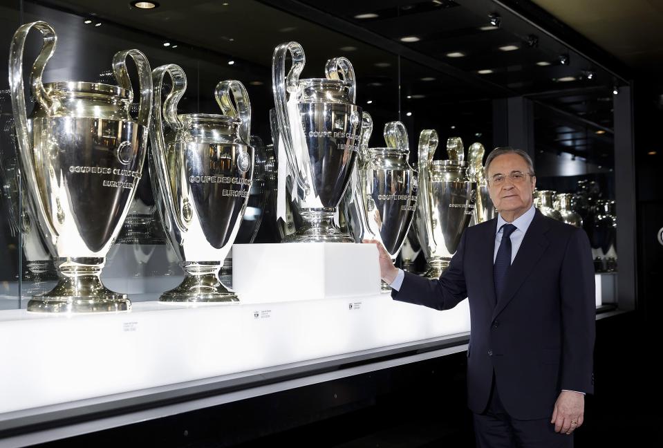  Real president Florentino Perez stands alongside the packed cabinet