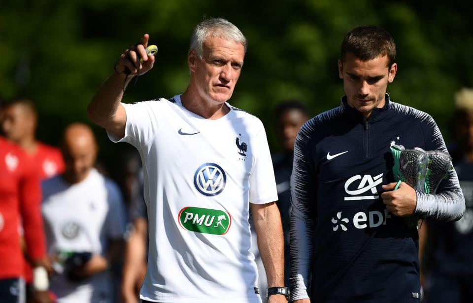 Didier Deschamps chats to Antoine Griezmann during France training camp