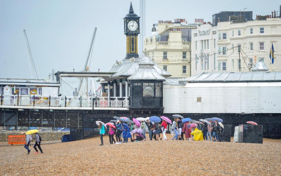  Many were determined to get to the beach despite the wind and rain