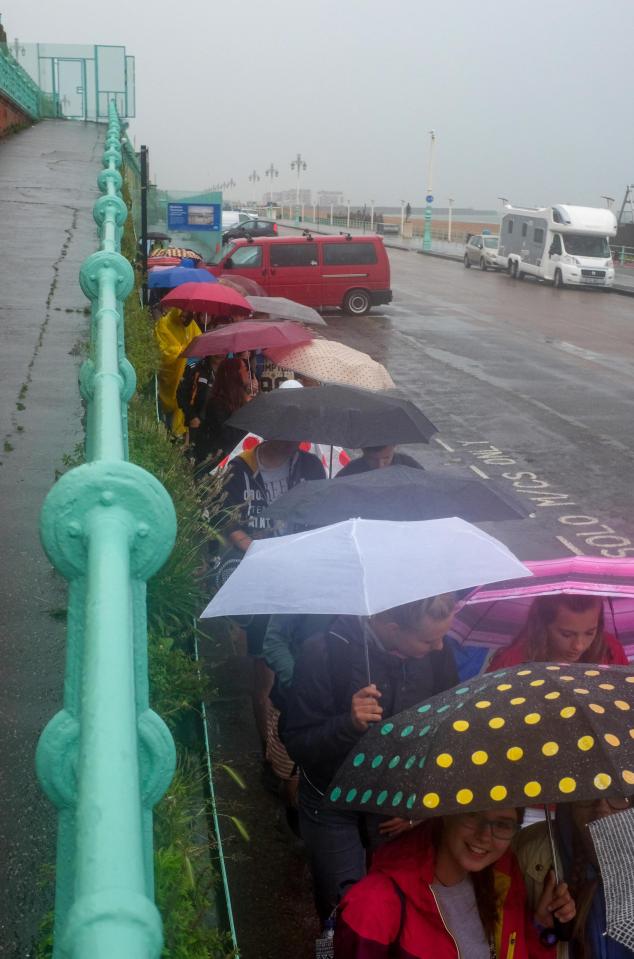  People in Brighton were left huddled under their umbrellas as the wet weather hit