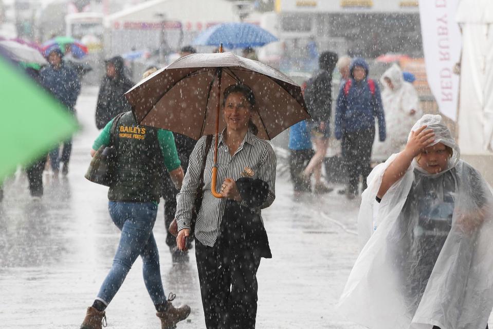  Visitors to the Bath and West Show in Somerset head for cover as torrential rain strikes the region