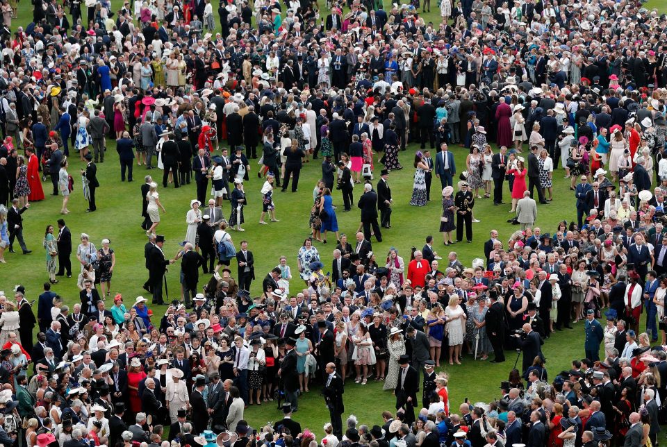  Guests line up at the start of Queen Elizabeth II's Garden Party