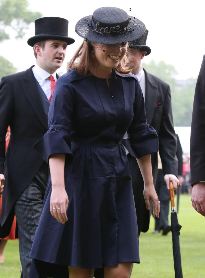  Princess Eugenie made sure not to upstage The Queen in a navy dress