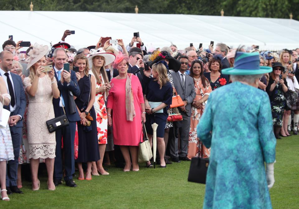  Many were keen to sneak a photo of the Queen