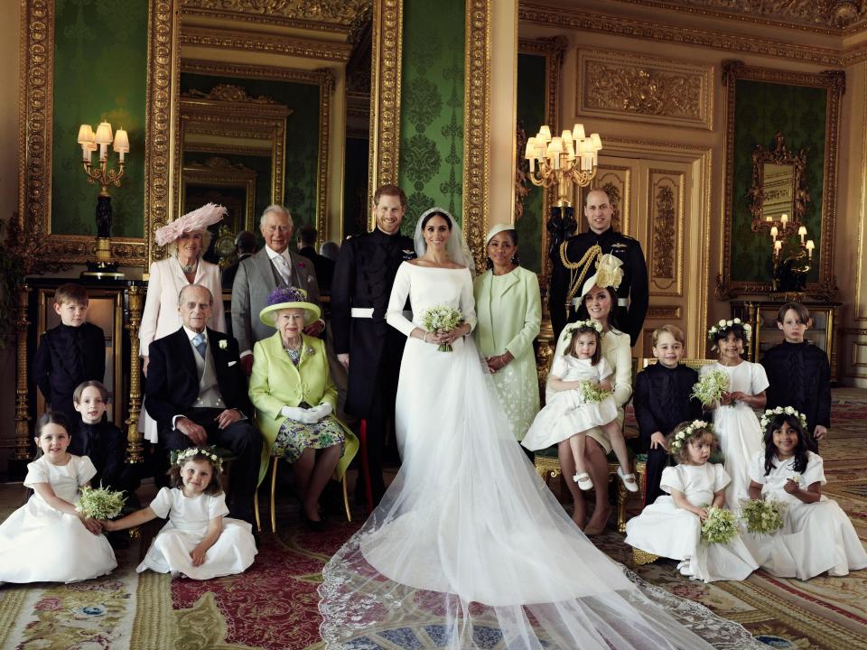  The Duke and Duchess of Sussex with the royal family in one of their official wedding photos