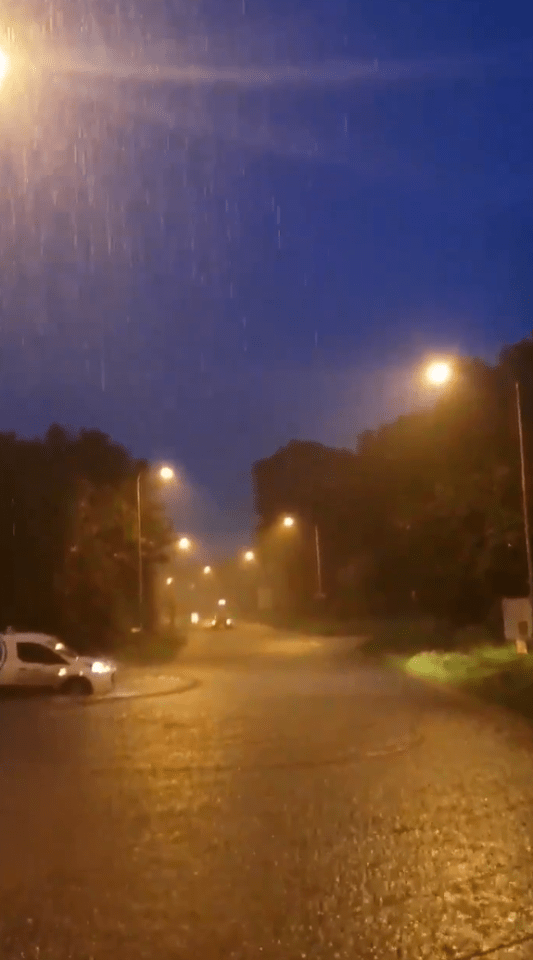  A Thames Water van patrols local Oxfordshire roads following torrential downpours