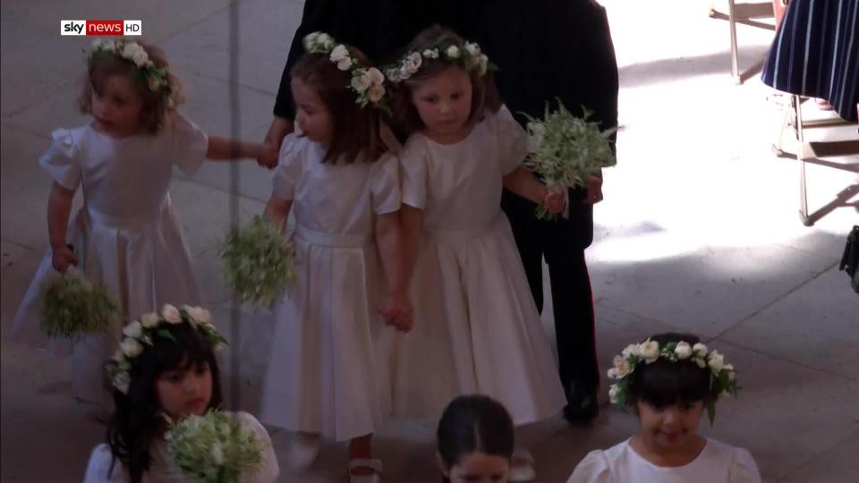  The girls looked adorable in white dresses with flowers in their hair