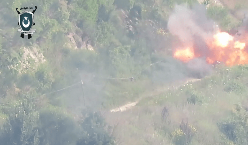  The missile explodes as it hits the ground right near the group of alleged allies to Assad