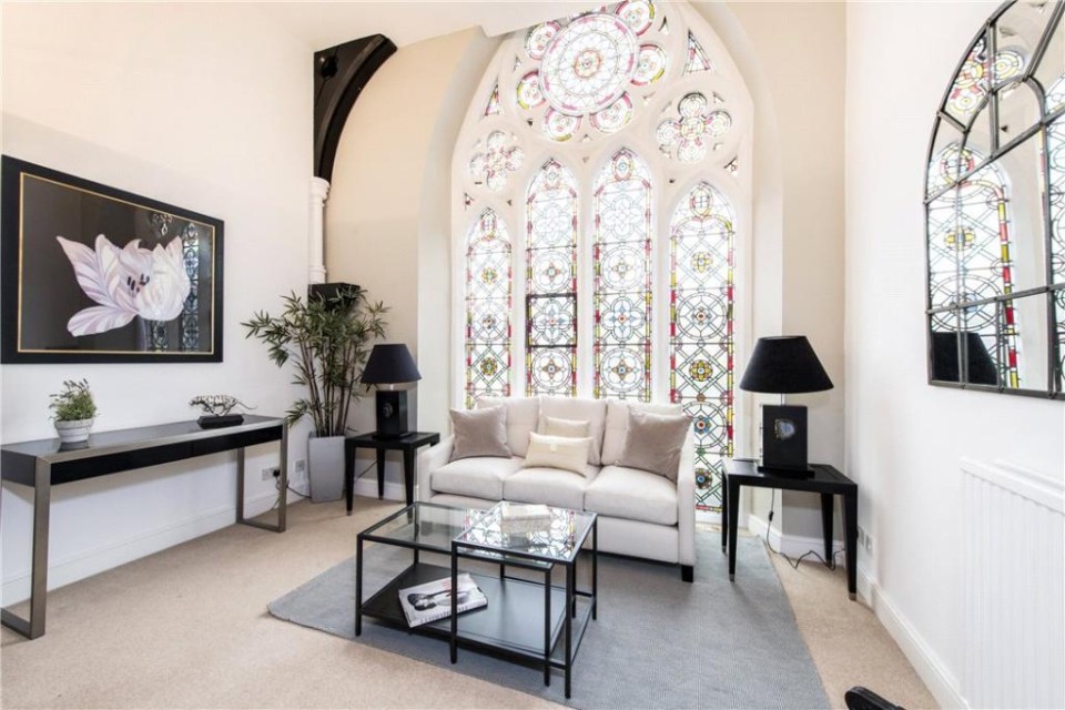 A striking feature of this flat is that every room apart from the kitchen has stained glass windows and other original church features