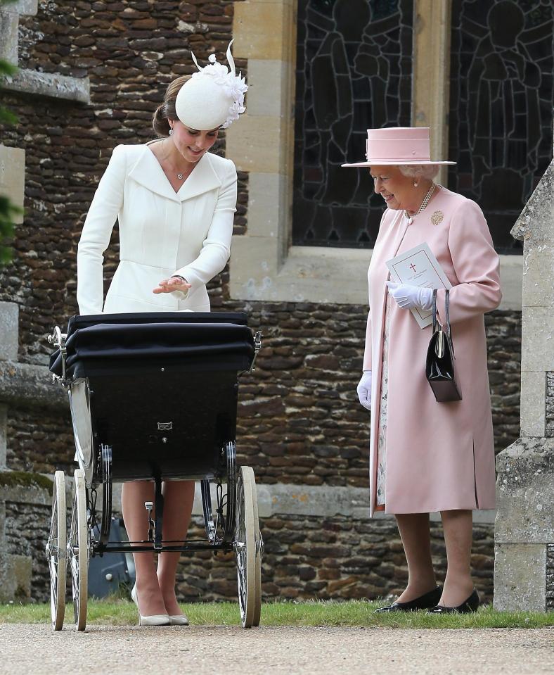  Kate, in her Alexander McQueen frock, at Princess Charlotte's christening