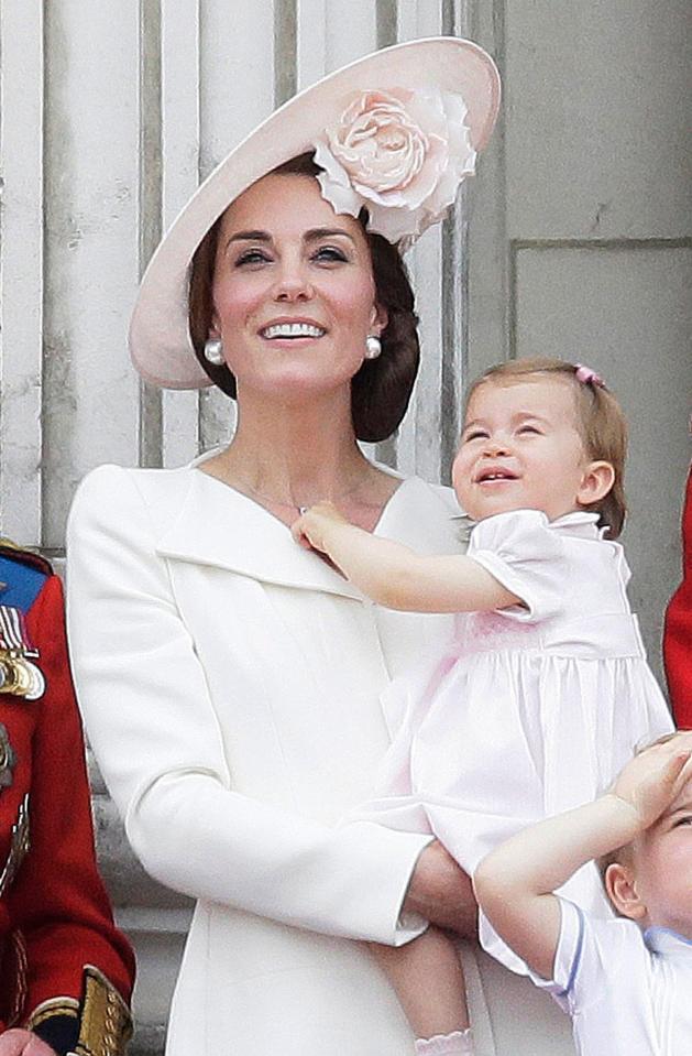  Kate, with Princess Charlotte, in her virtually identical dress