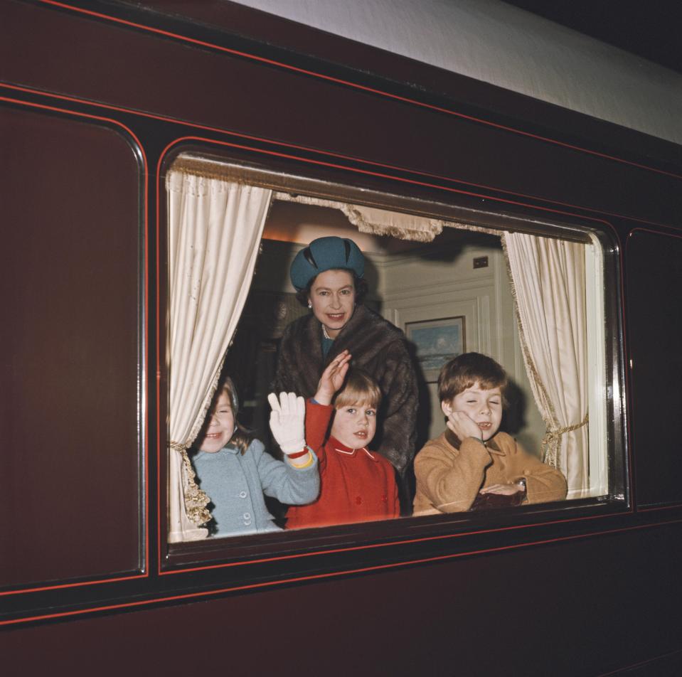  The Queen with Prince Andrew (right) and Prince Edward (centre) in a compartment of the Royal Train before departure from London in December 1965