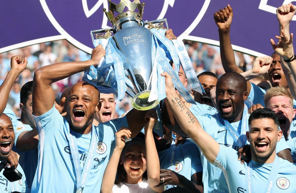  Vincent Kompany, left, is chasing World Cup glory after helping Man City win the Prem title