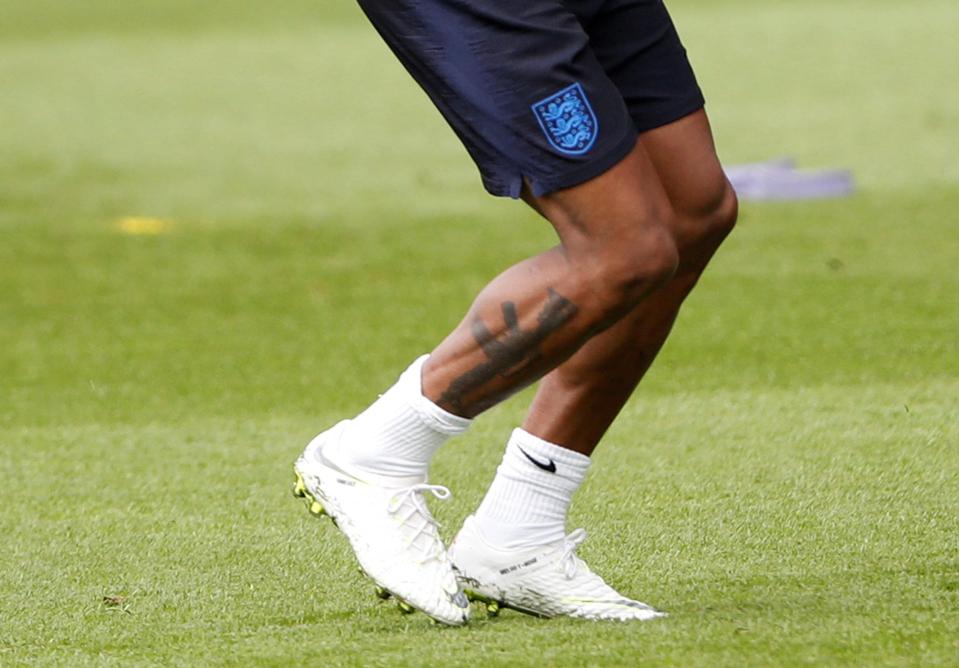  The Man City and England star has an assault rifle tattooed on his calf - in honour of his father