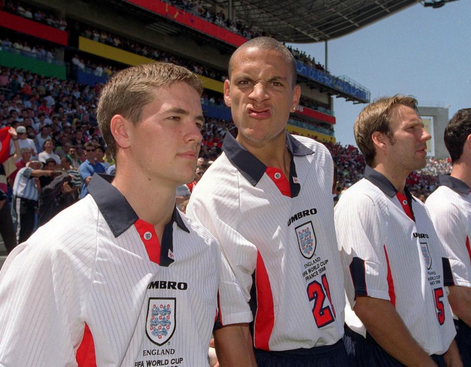  Michael Owen, who came on as a substitute, lines up before the game with Rio Ferdinand