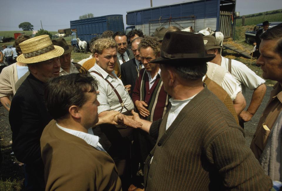  Travellers are seen embroiled in a discussion at the annual event in the 1970s