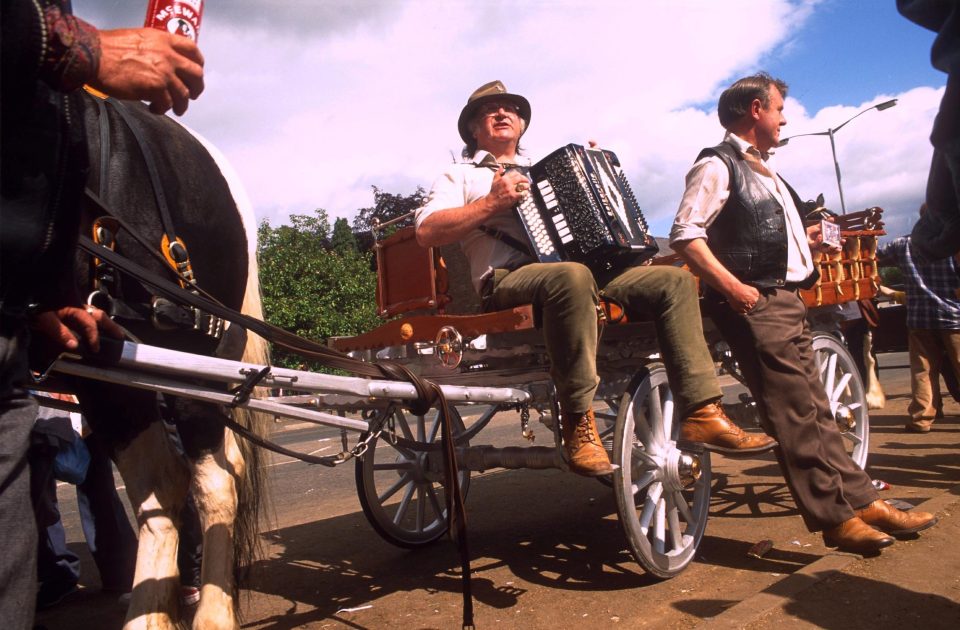  Travellers enjoy a sing-song at the annual horse fair in Cumbria in 1996