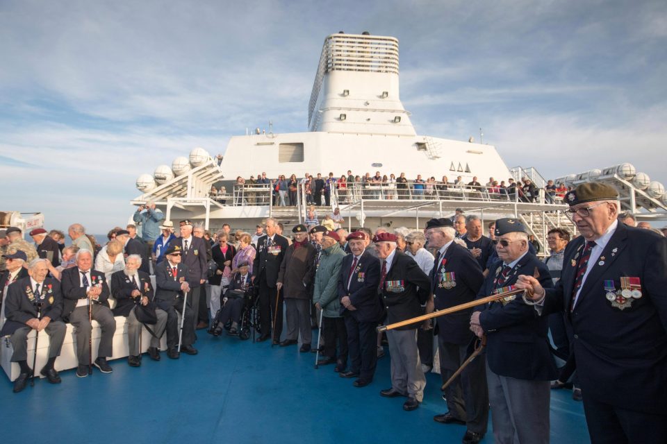  Normandy veterans attend an at-sea wreath laying ceremony on the deck of the Brittany ferry from Portsmouth to Caen as they travel to Normandy