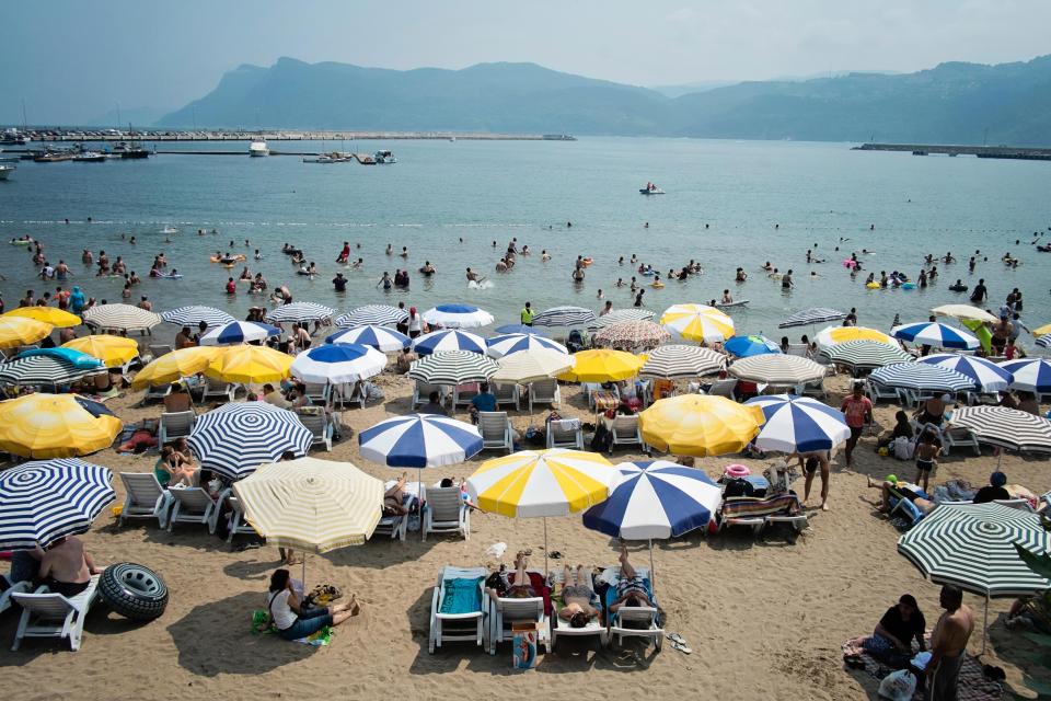 Tourists enjoy the beach, sea and sunshine at the holiday resort town of Amasra in Bartin but trouble may not be far away