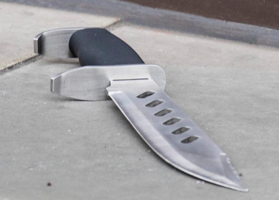  One of the deadly knives used by the gang is left at the scene of the crime in Regent Street