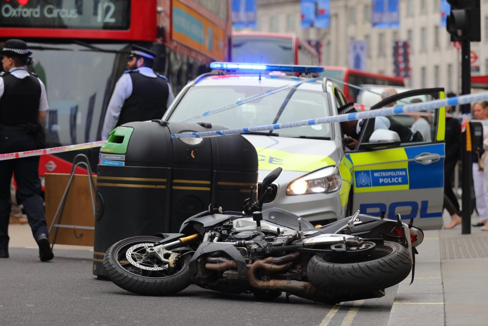 The bike of a raider is left at the scene of the robbery in Regent Street today