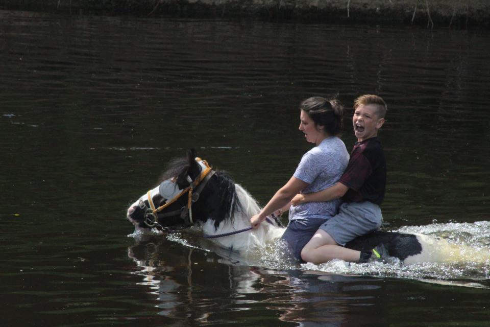  A pair of young travellers go for a horse-back dip in Appleby