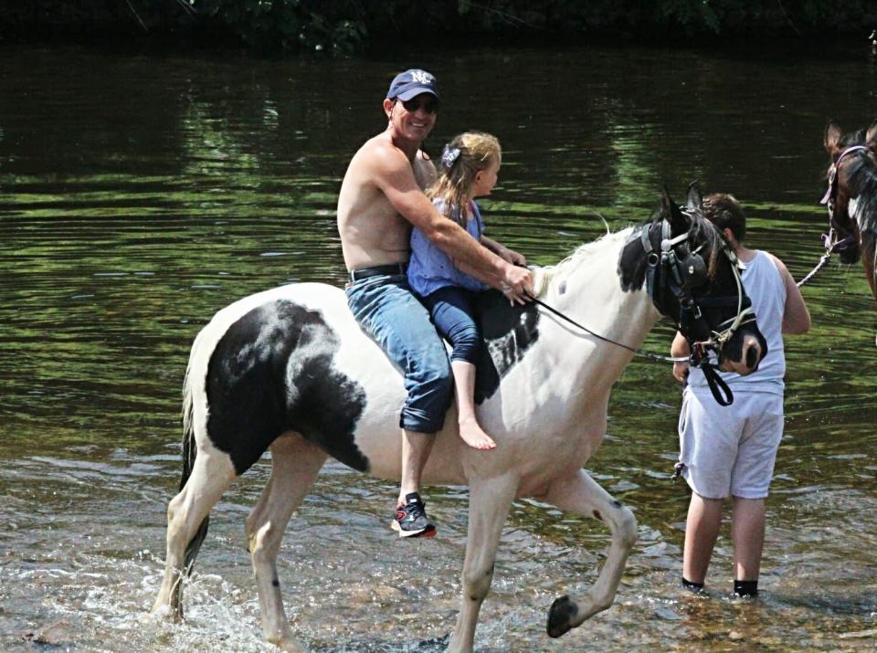  A little girl is taken for a ride in the waters of the river Eden