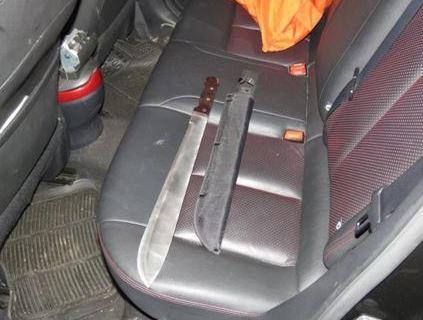 Marshall had a huge machete on him and another was on the back seat when cops stopped the gang’s car