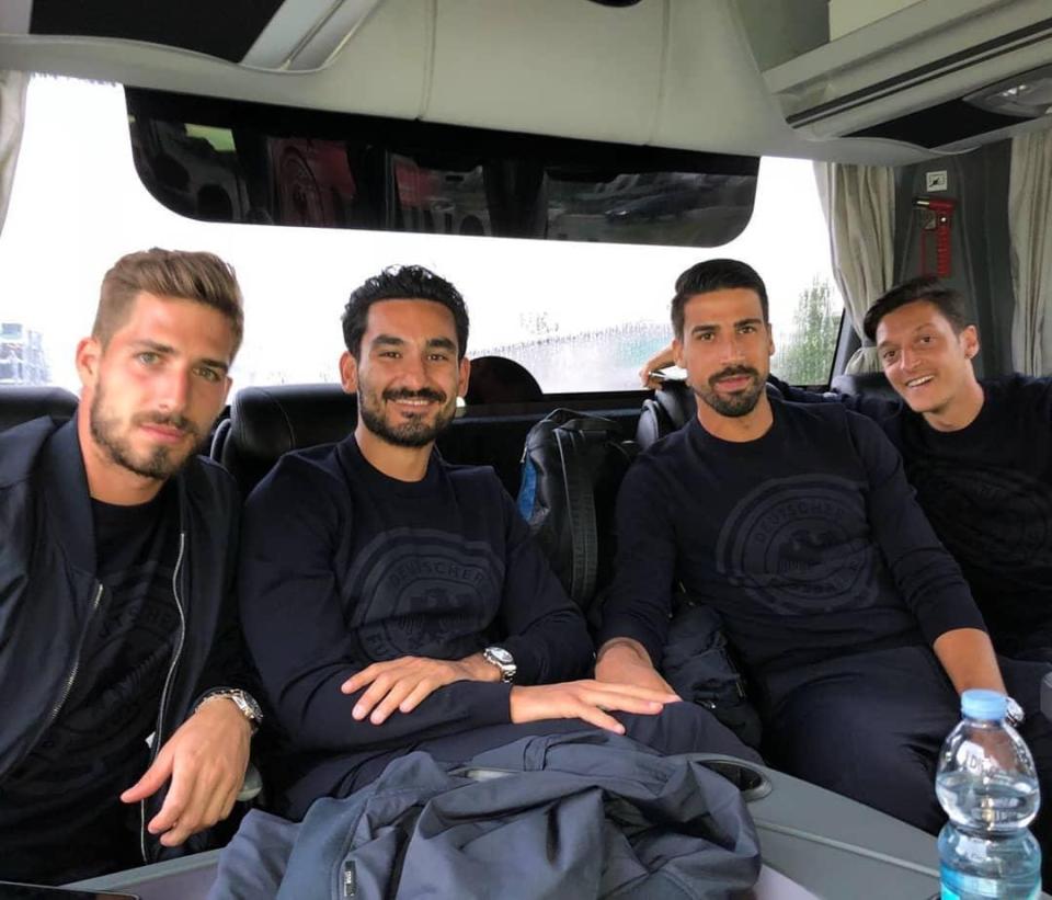  Mesut Ozil eased fears over his injury by posting a picture of him smiling on the Germany team bus