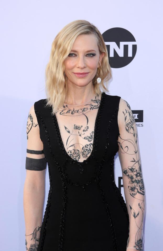  Cate Blanchett wore a black dress with floral patterns, that looked like tattoos, over sheer sleeves