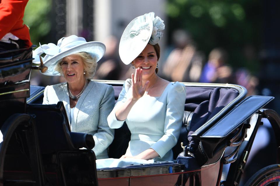  Camilla and Kate wave to the crowds during the ceremony today