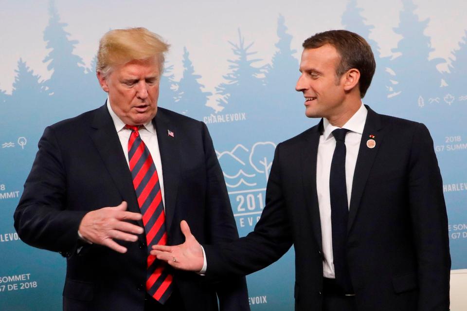  Trump and Macron shake hands at the G7 summit last year