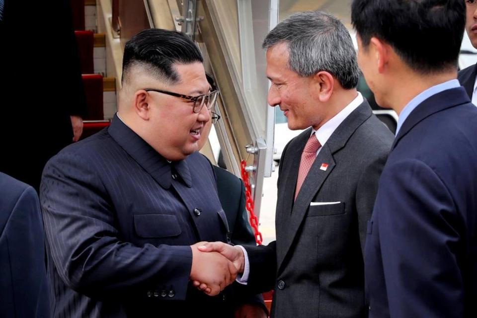  Kim Jong-un is welcomed by Balakrishnan at the city-state's airport