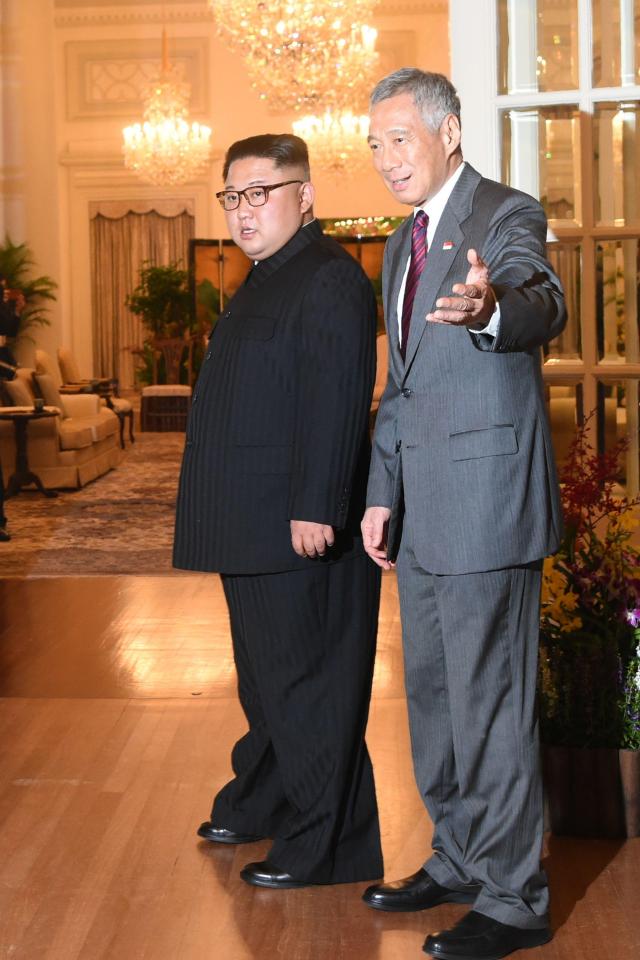  The diminutive despot is dwarfed by Singapore's PM Loong